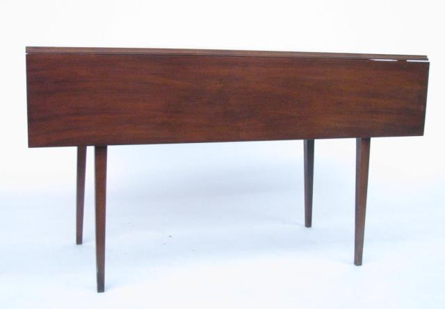 Appraisal: A drop leaf cherry dining table with square tapered legs