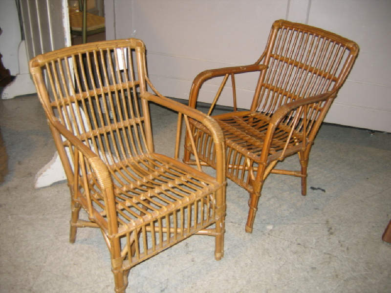 Appraisal: FOUR RATTAN OPEN ARMCHAIRS h w Provenance Estate of George