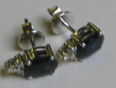 Appraisal: A PAIR OF SAPPHIRE AND DIAMOND EAR STUDS comprising oval