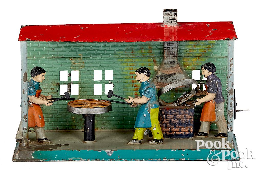 Appraisal: Wheelwright shop steam toy accessory Painted and embossed tin wheelwright