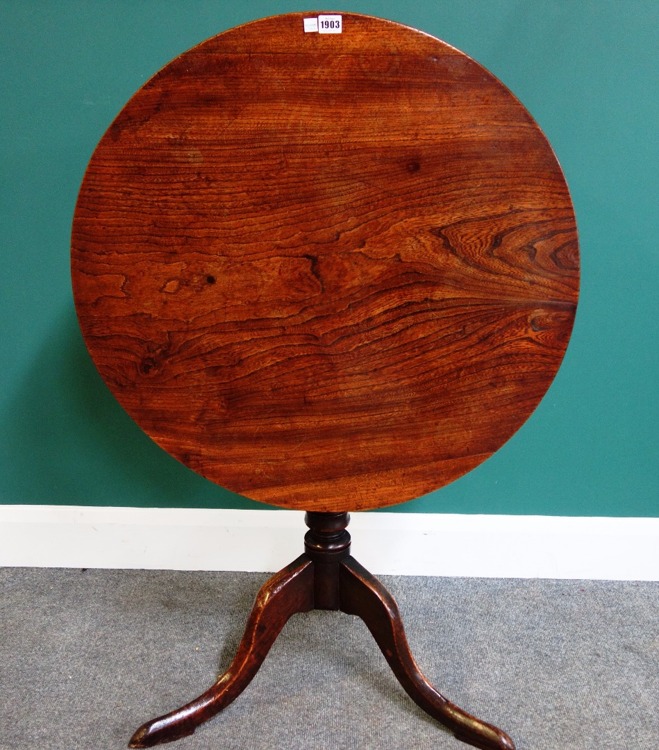 Appraisal: A mid- th occasional table the circular elm snap top