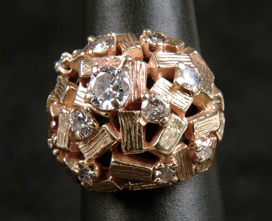 Appraisal: GOLD DIAMOND RING Unusual domed ring is made of k