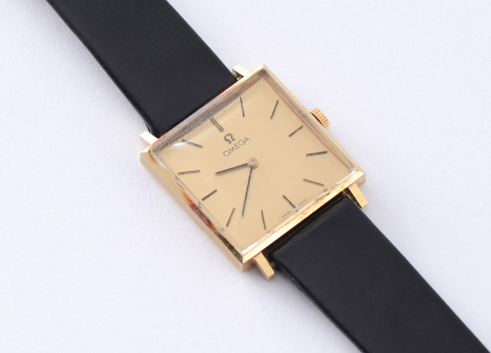 Appraisal: VINTAGE OMEGA K GOLD WRIST WATCH Square dial wrist watch