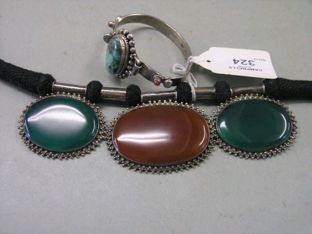 Appraisal: A hardstone collarette and an imported silver bracelet with inset