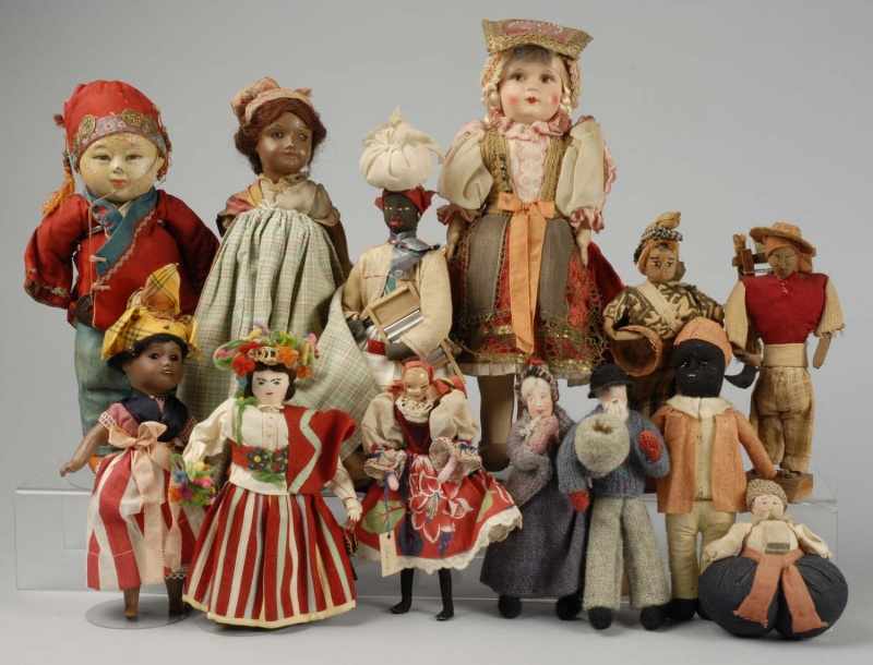 Appraisal: Lot of Souvenir and Travel Dolls Description Unis France brown