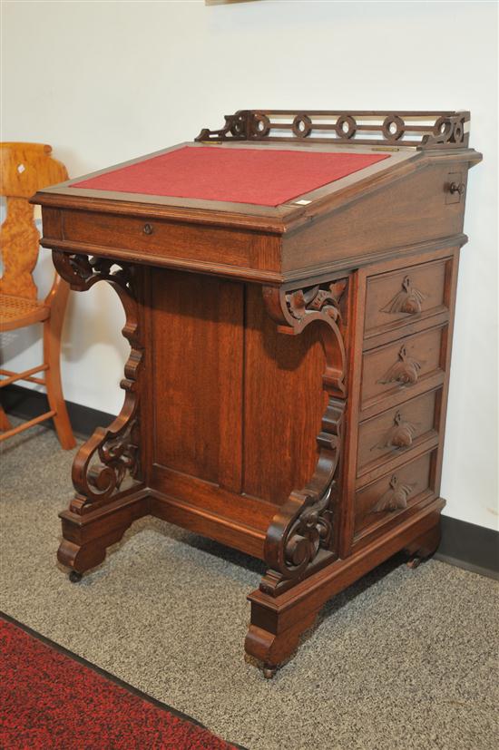 Appraisal: DAVENPORT DESK Walnut with poplar scondary having a pierced gallery