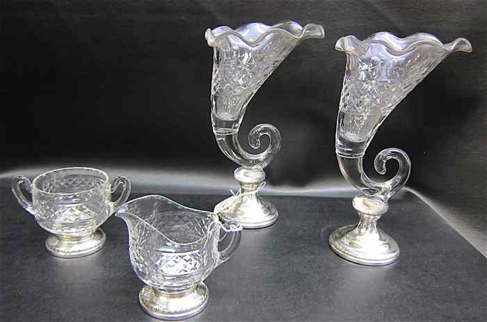 Appraisal: FOUR GLASS STERLING TABLEWARE ITEMS made by Sheffield Silver Co