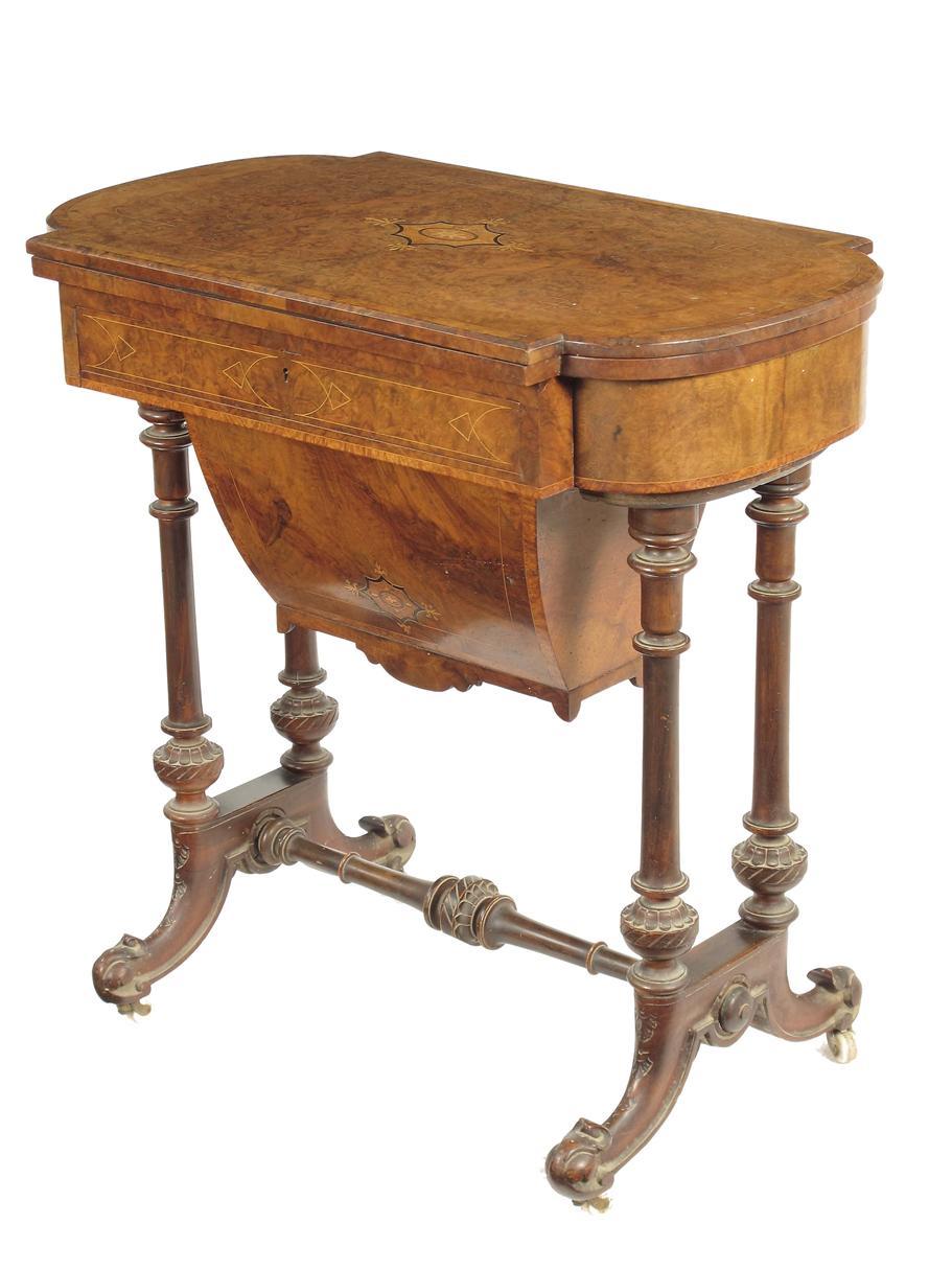 Appraisal: A Victorian walnut games and sewing table