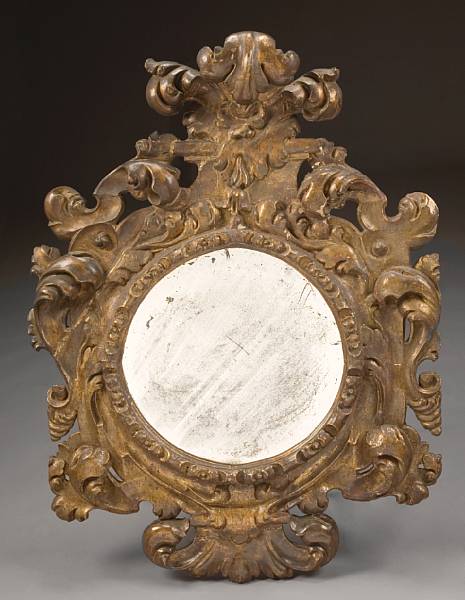 Appraisal: A Spanish Baroque giltwood mirror early th century The circular