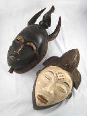 Appraisal: Two tribal masks one from the Pounou tribe Gabon the