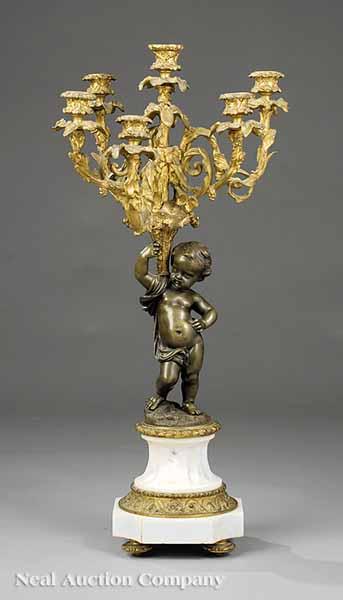 Appraisal: A French Gilt and Patinated Bronze Cherub Candelabrum in the