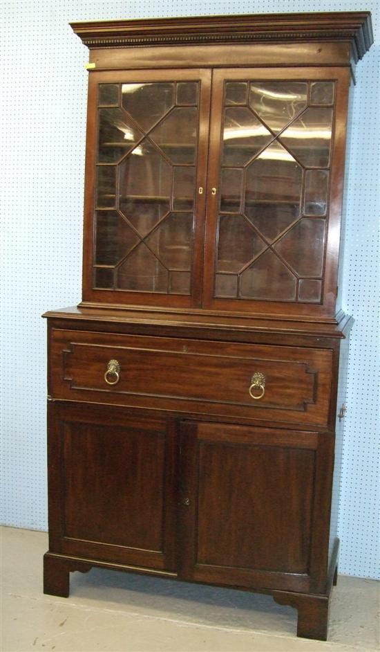 Appraisal: George III mahogany secretaire chest with later bookcase top on