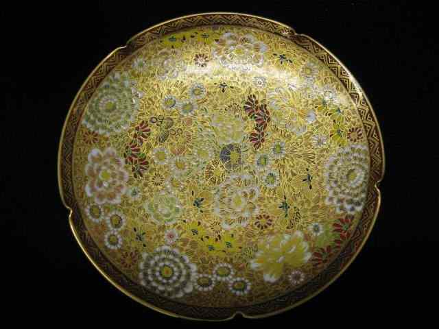 Appraisal: Japanese Satsuma Pottery Dish elaborate floral goldwork signed '' excellent