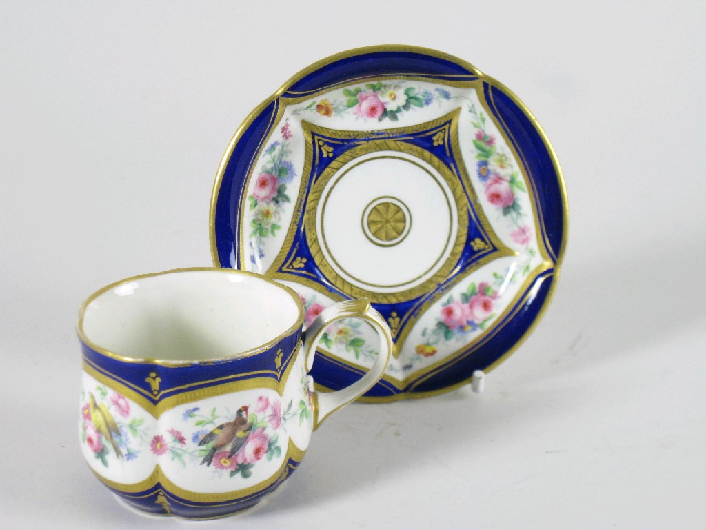 Appraisal: A Sevres Cup and Saucer painted frieze of flowers and