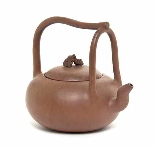 Appraisal: An Yixing Pottery Teapot of squat form having a curved