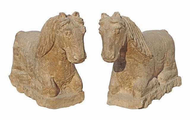 Appraisal: pair Chinese carved stone sculptures depicting recumbent horse figures laying