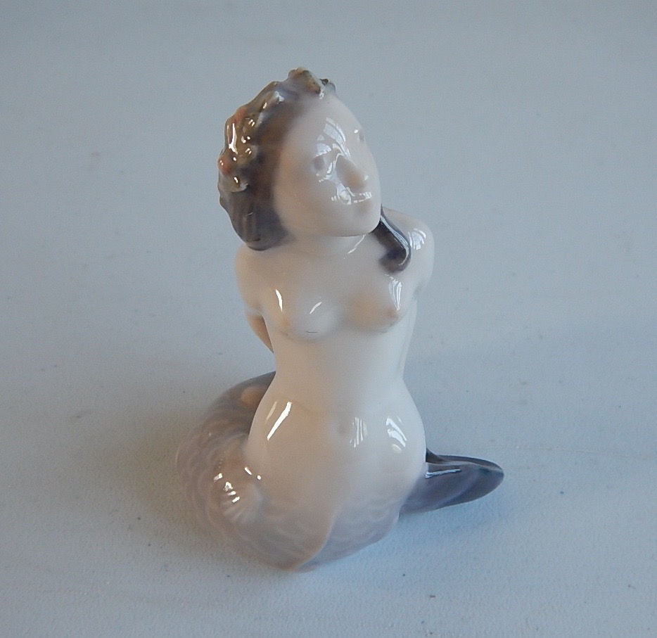 Appraisal: A Royal Copenhagen model of a mermaid gazing skywards cm