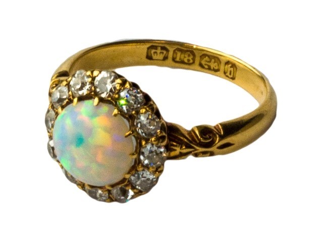 Appraisal: A Victorian ct gold opal and diamond set cluster ring