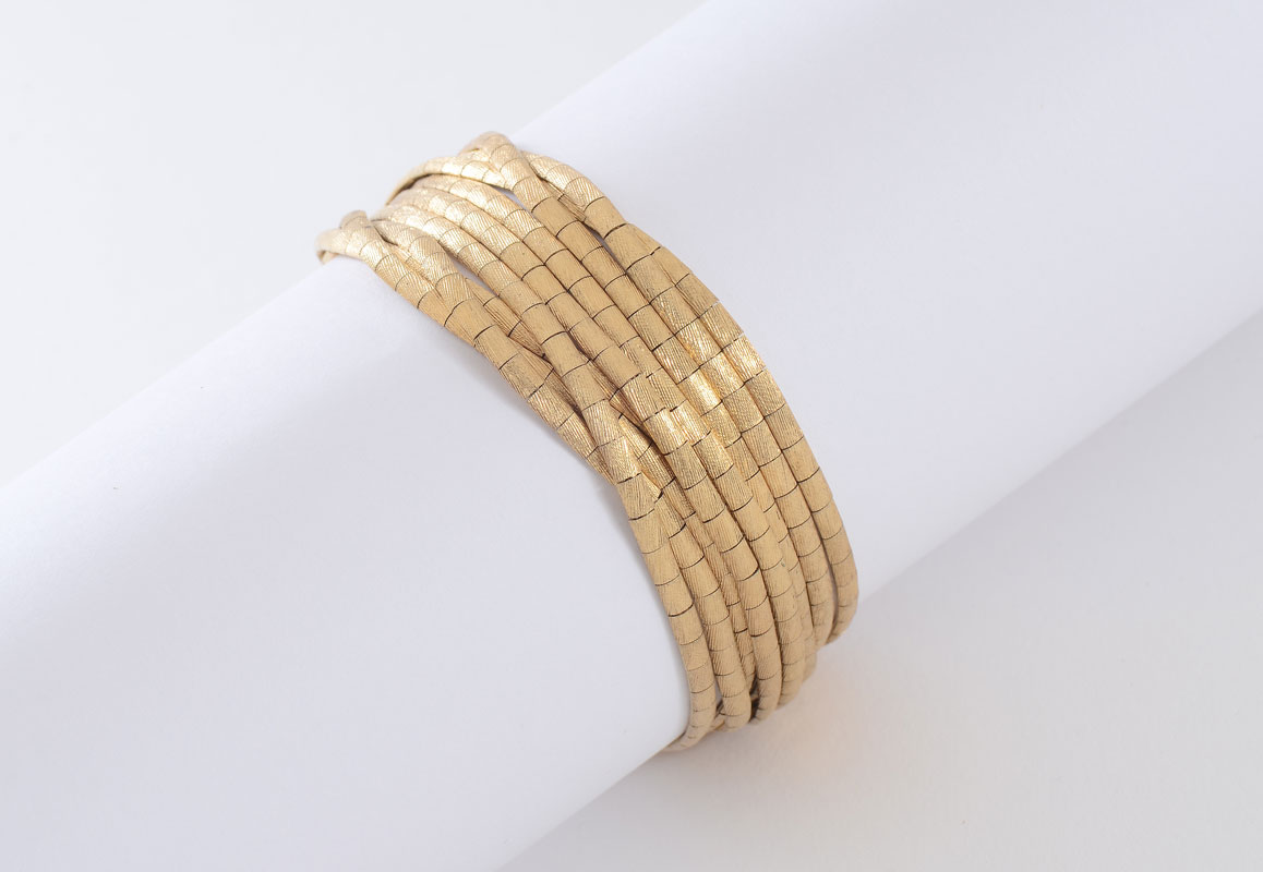 Appraisal: K GOLD MID-CENTURY SPAGHETTI BRACELET K yellow gold bracelet with