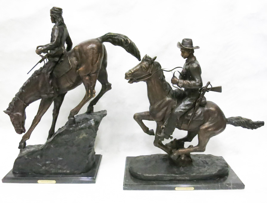 Appraisal: TWO PATINATED BRONZE SCULPTURES after Remington depicting men on horseback