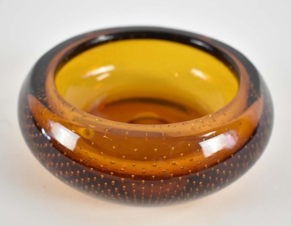 Appraisal: MID CENTURY AMBER GLASS ASHTRAYCirca Circular with allover evenly spaced