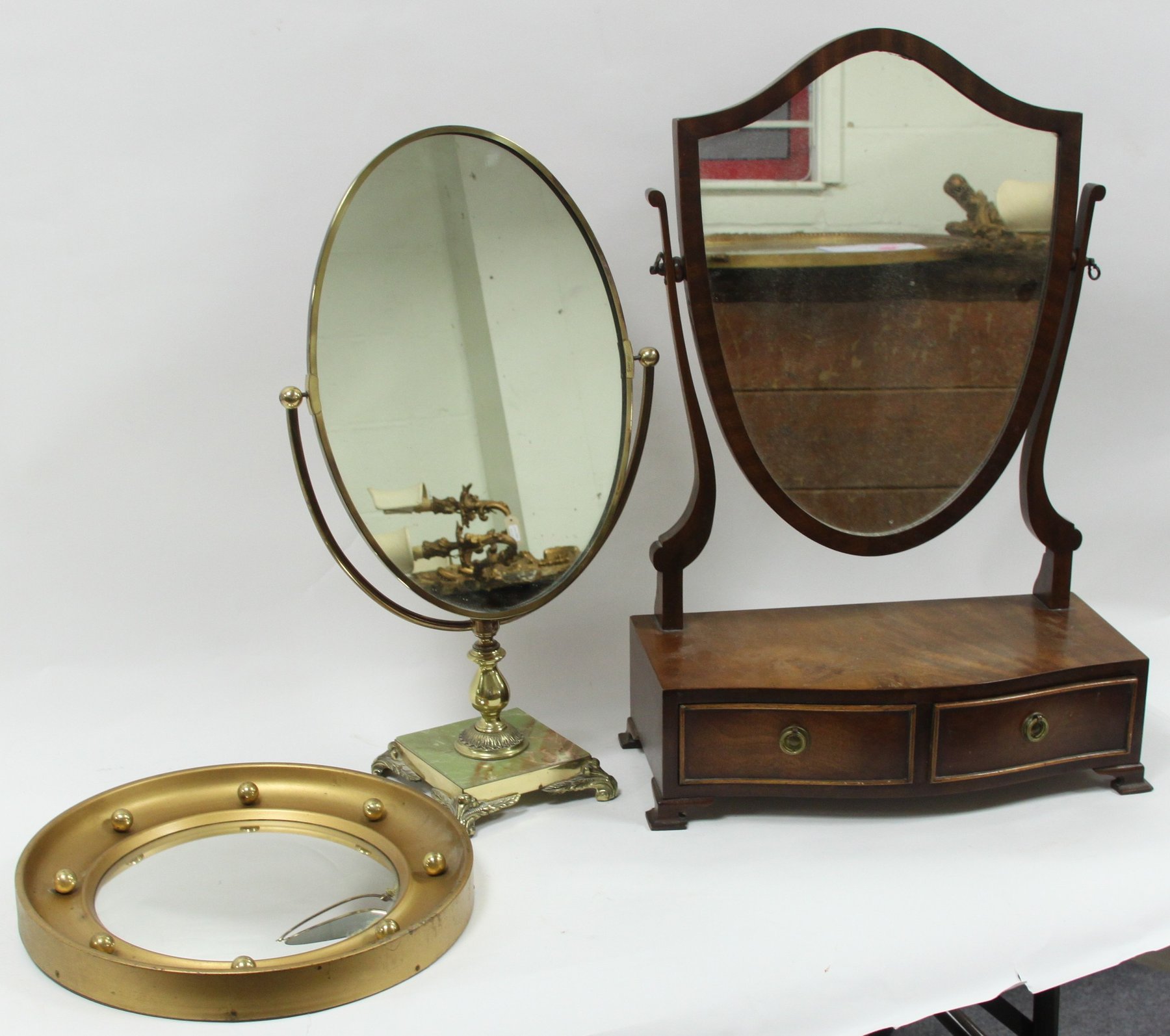 Appraisal: A small gilt framed mirror with convex glass the plate