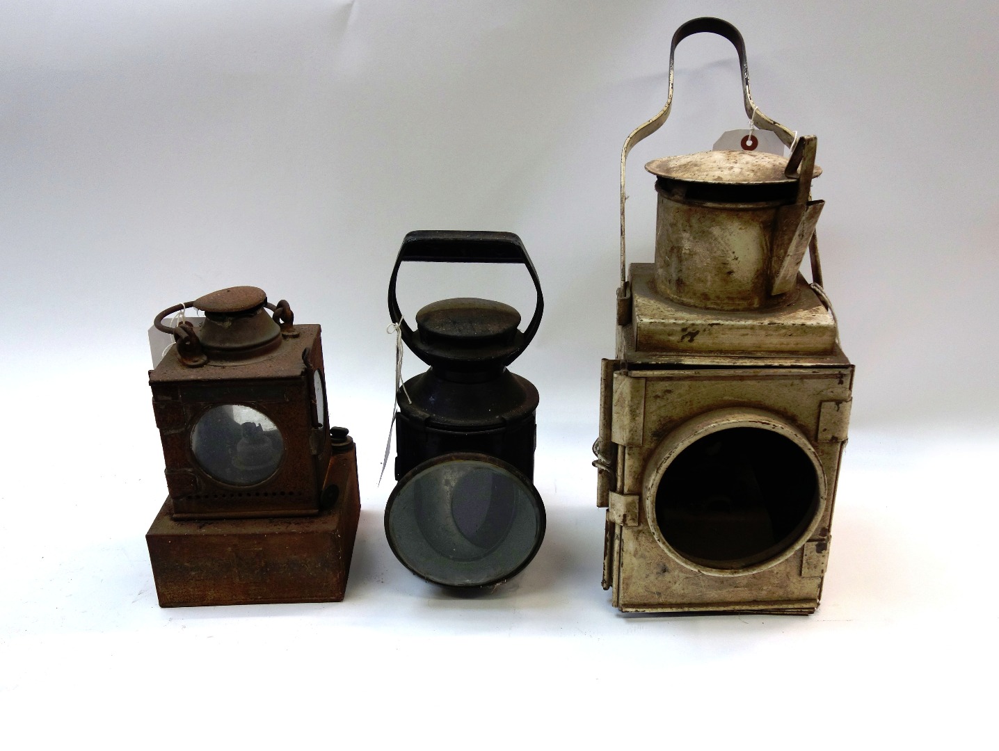 Appraisal: A group of three vintage railway lamps including a black