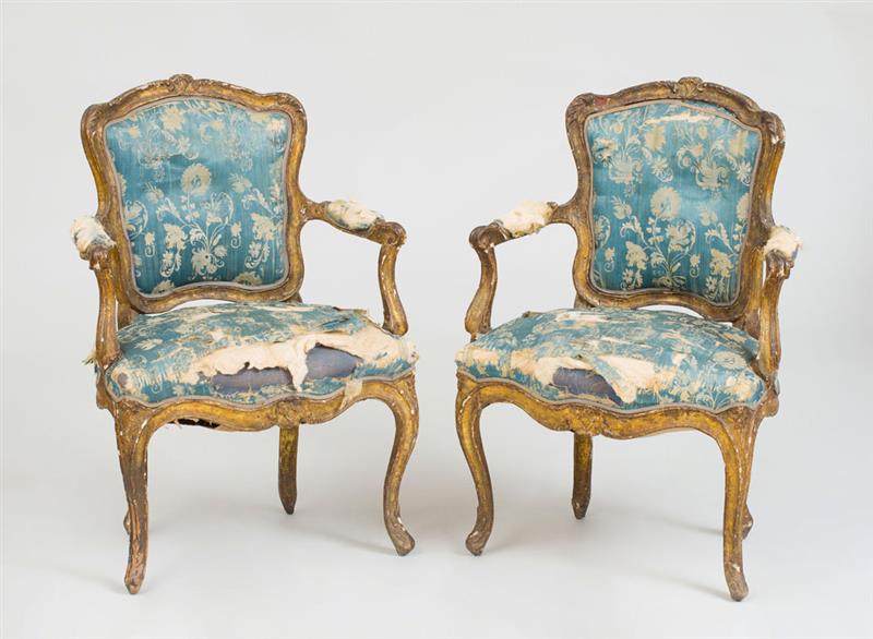 Appraisal: PAIR OF ITALIAN ROCOCO GILTWOOD ARMCHAIRS Upholstered in silk damask