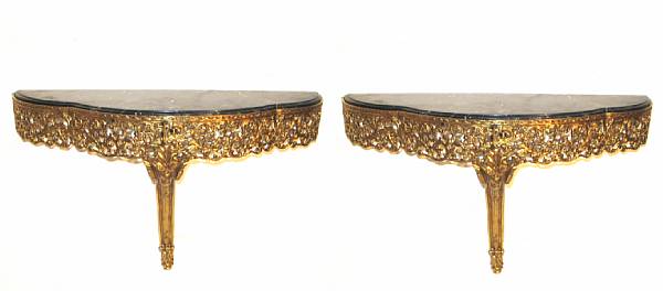 Appraisal: A pair of Louis XVI style bronze consoles with marble