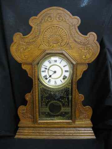 Appraisal: Victorian Oak Gingerbread Clock gold stenciled glass '' tall working