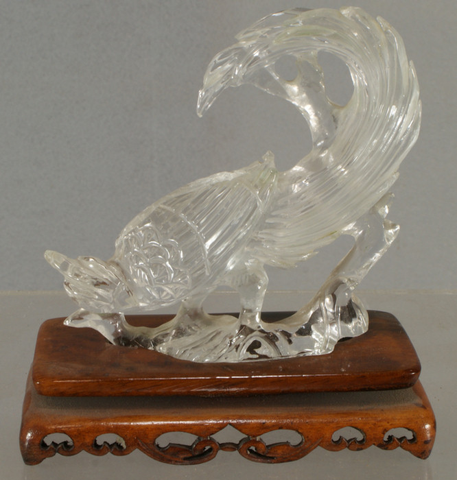 Appraisal: Chinese carved rock crystal exotic bird with custom stand the