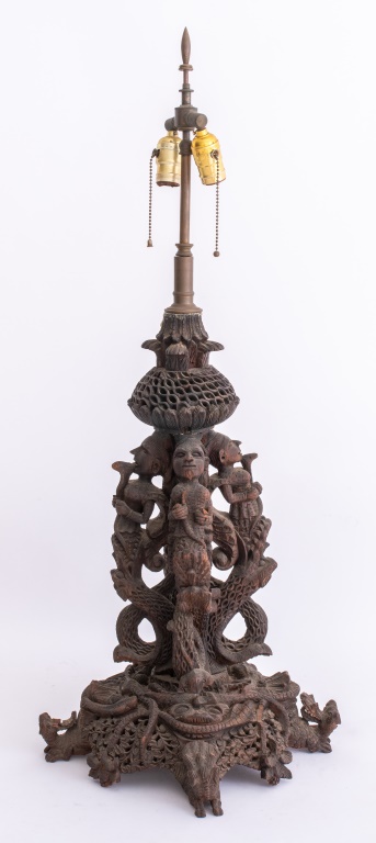 Appraisal: BURMESE CARVED WOOD SCULPTURAL TABLE LAMP Burmese large sculptural table