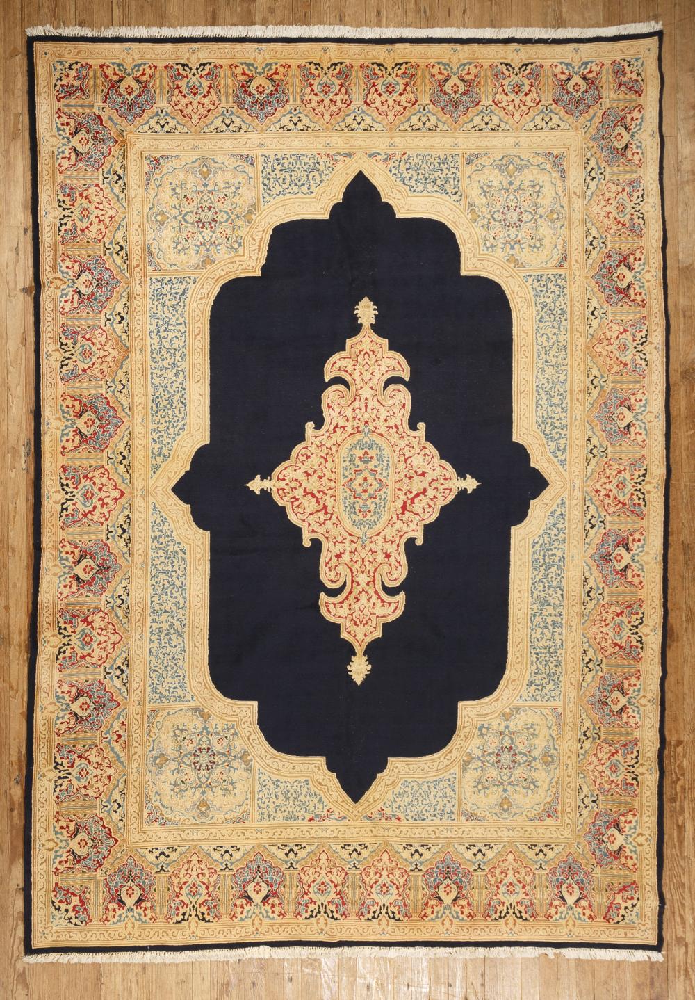 Appraisal: Persian Kerman Carpet blue central ground central medallion repeating floral