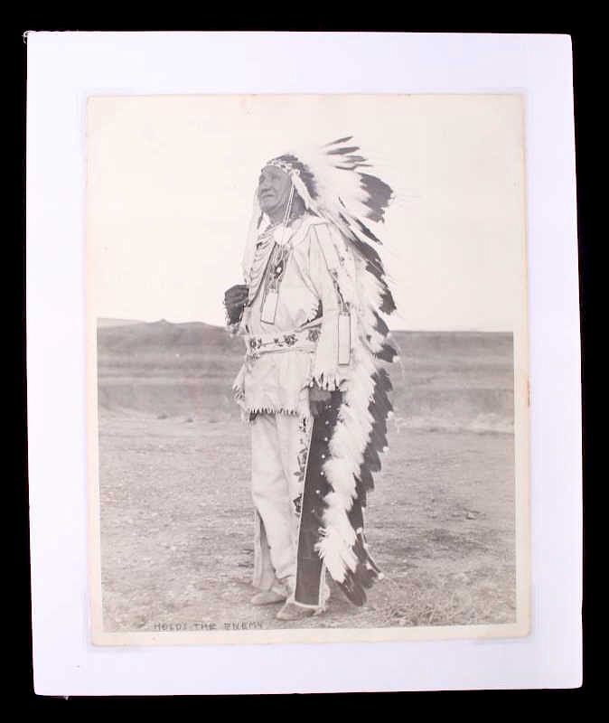 Appraisal: Original Crow Chief Holds The Enemy Photograph For bidding in