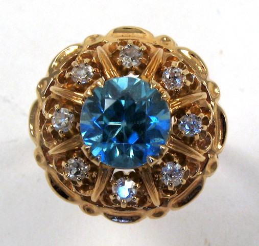 Appraisal: ZIRCON AND DIAMOND RING k yellow gold and centering a