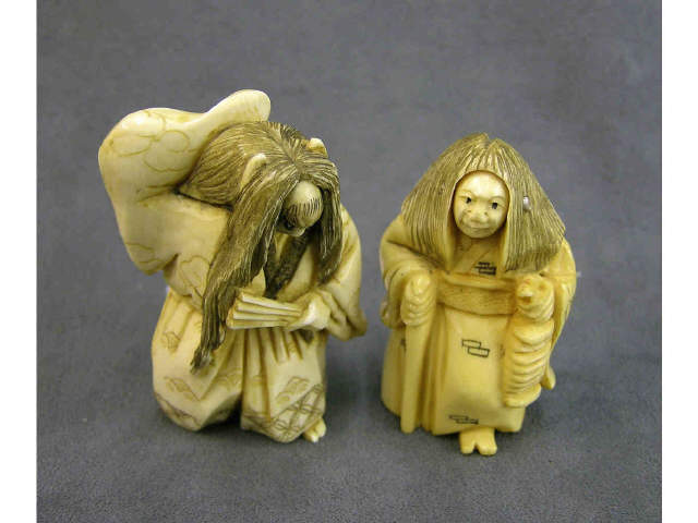 Appraisal: Two turning face ivory netsuke