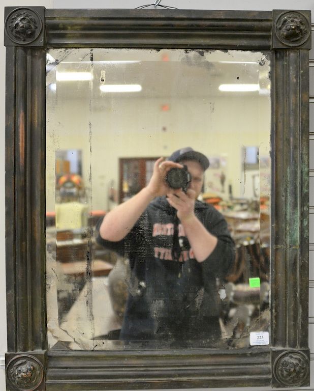 Appraisal: Pair of metal framed mirrors with embossed lion corners x