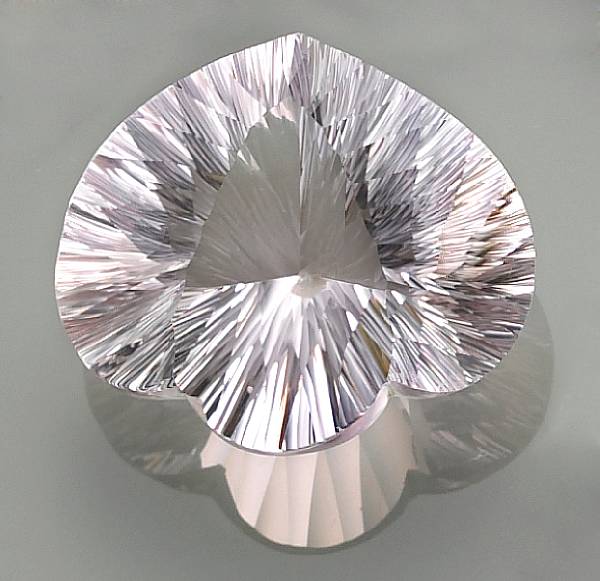 Appraisal: Fancy-cut Near-Colorless Quartz Fashioned as a fancy shield-shape stone this