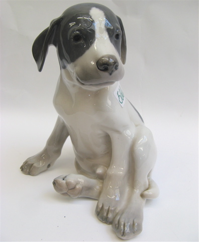 Appraisal: ROYAL COPENHAGEN GLAZED PORCELAIN FIGURE of a seated Labrador puppy