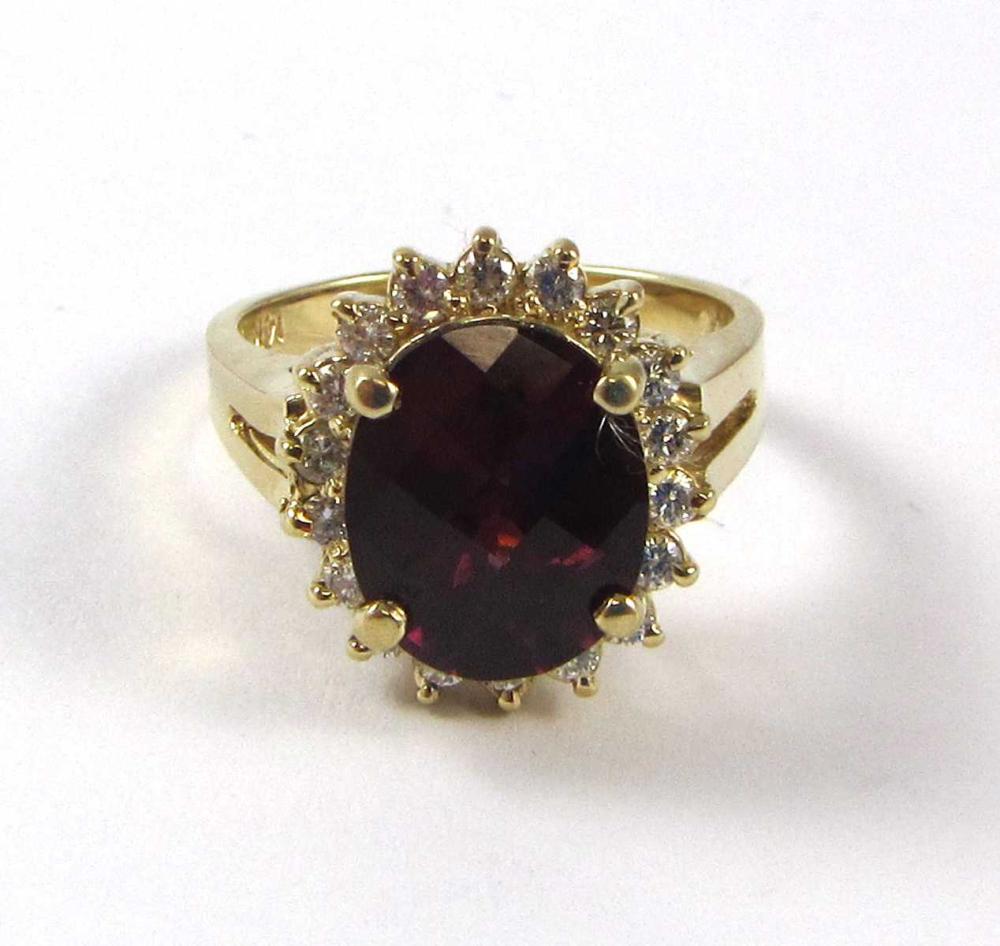 Appraisal: GARNET DIAMOND AND FOURTEEN KARAT GOLD RING with round-cut diamonds