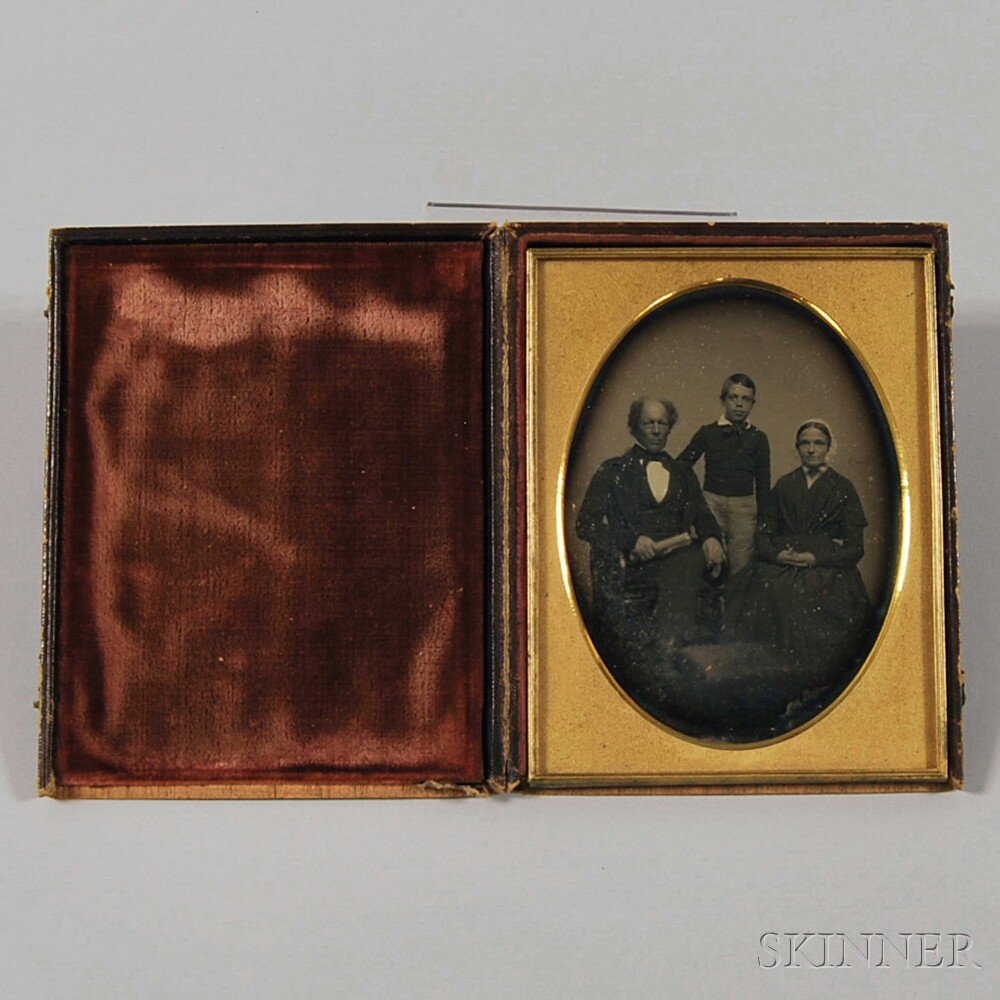 Appraisal: Half-plate Daguerreotype Portrait of a Family depicting a boy standing