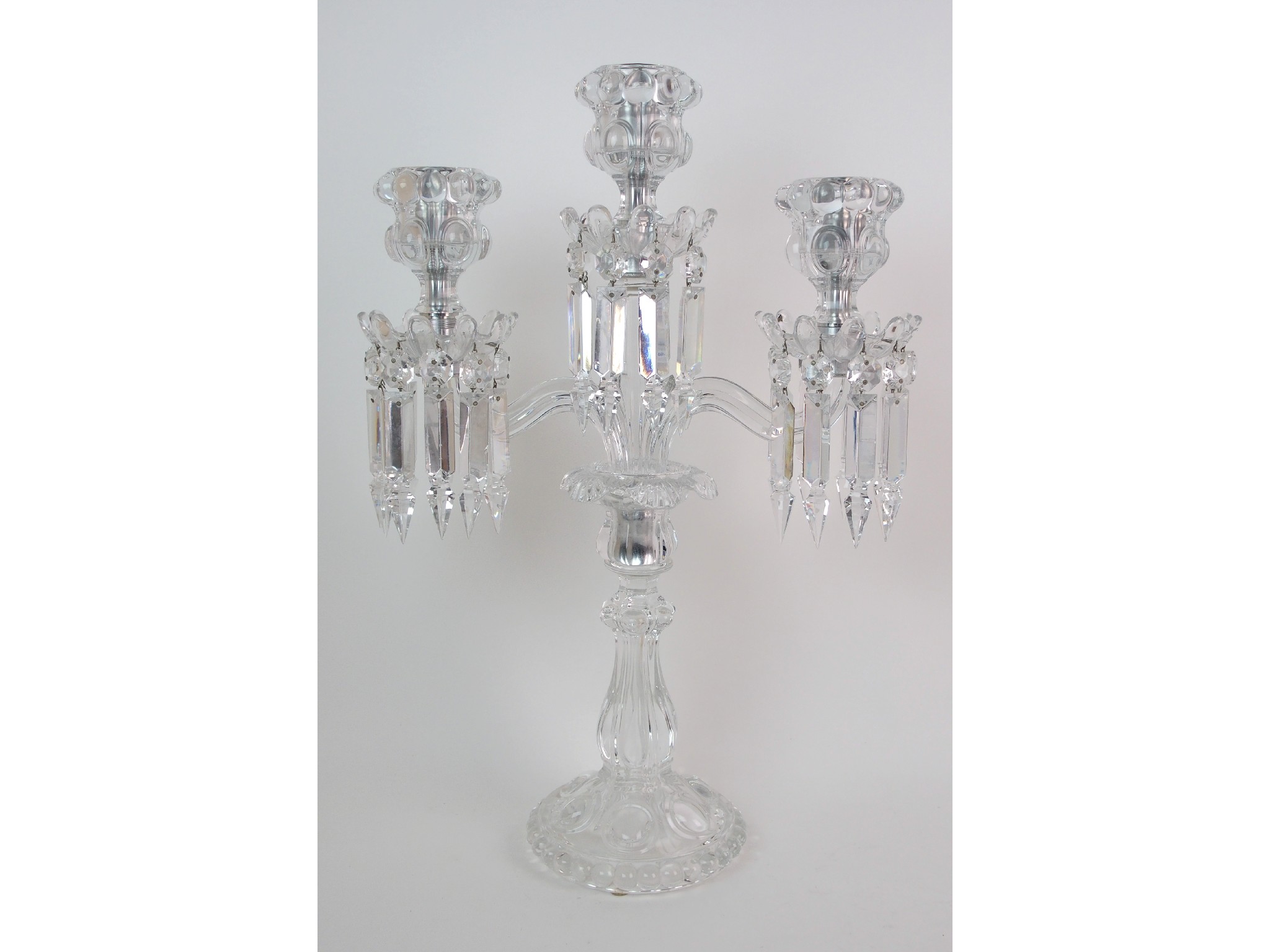 Appraisal: A Baccarat crystal three-light candelabramoulded glass baluster-form standard with single