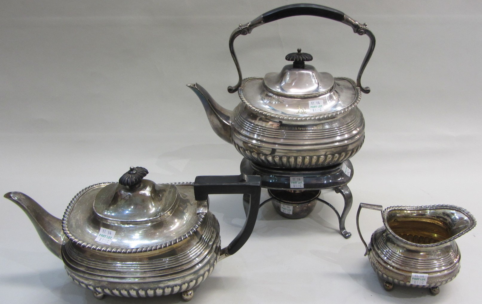 Appraisal: A silver teapot with partly fluted decoration within a gadrooned