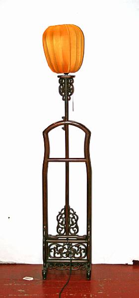 Appraisal: An adjustable rosewood candlestand The tall stand with reticulated dragon