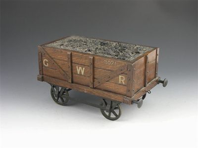 Appraisal: A late Victorian oak cigarette box modelled as a coal