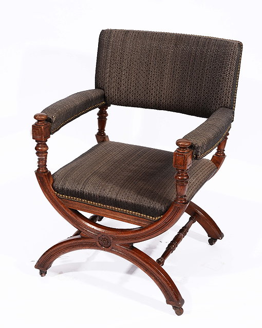 Appraisal: A LATE VICTORIAN OAK FRAMED ELBOW CHAIR with inverted hoop