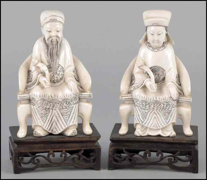 Appraisal: TWO CHINESE CARVED IVORY IMPERIAL FIGURES Raised on '' wood