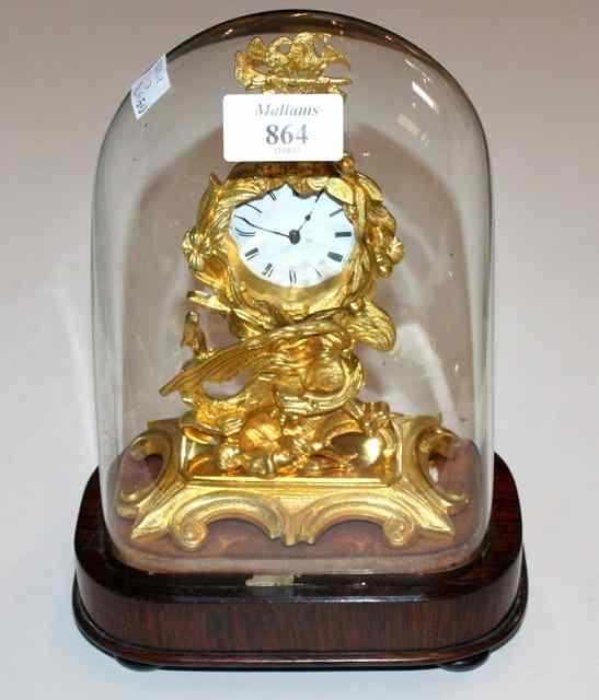 Appraisal: AN ENGLISH ORMOLU MANTEL CLOCK with white enamel dial and