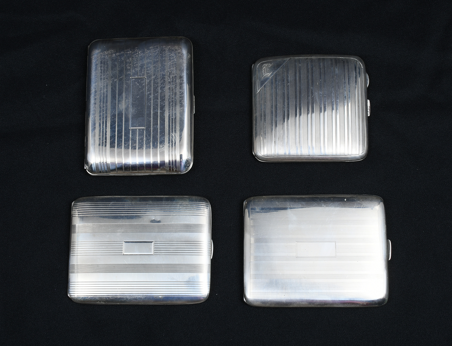 Appraisal: ART DECO STRIPED STERLING CIGARETTE CASES Comprising - Elgin American