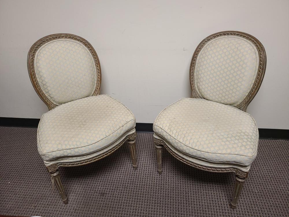 Appraisal: PAIR OF LOUIS XVI LIGHT GRAY PAINTED AND UPHOLSTERED CHAISES